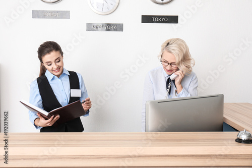 Female receptionist with tr...
