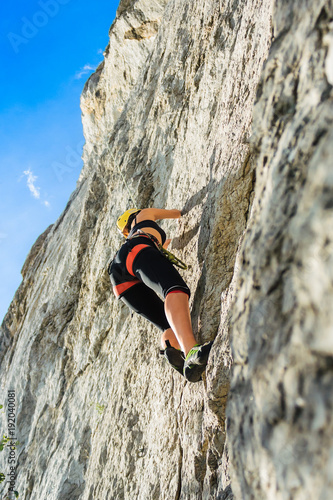 Beautiful girl climber on rocks in Crimea