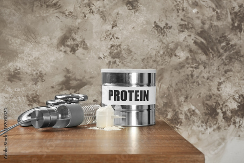 Composition with protein powder, bottle for shake on color background