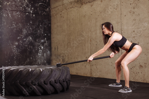 Woman Hits Tire With Sledgehammer Workout At Gym With Hammer And Tractor Tire Stock Photo Adobe Stock