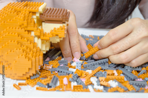 Asian women are receptive to the form of colored tiles for the construction.