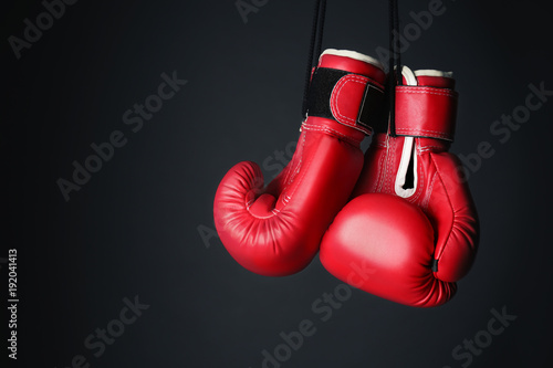 Boxing gloves on gray background © Africa Studio