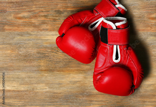 Boxing gloves on wooden background