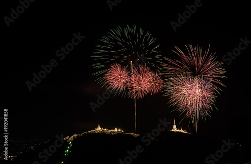 Firework and mountain on the night.