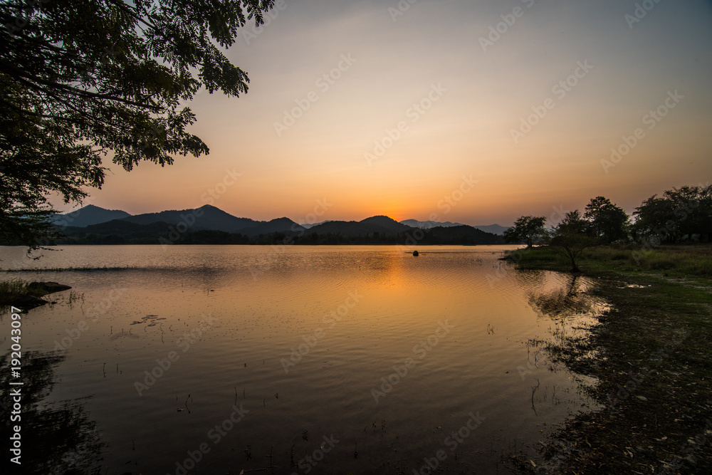 Landscape reservoir and mountain on sunset.