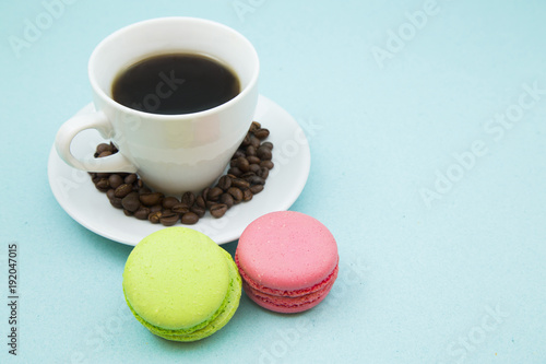 I love coffee concept. Coffee cup and pastry on blue background. Closeup