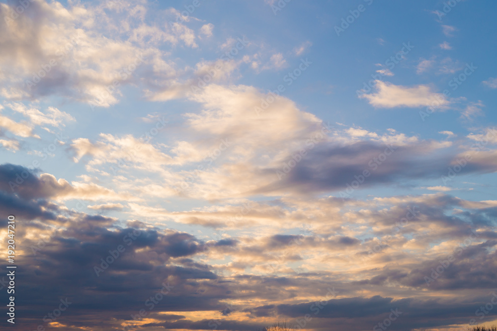 Colorful clouds on the  blue sky at sunset or sunrise