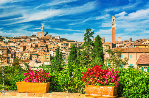 Obraz na płótnie Beautiful panoramic view of the historic city of Siena at sunset with an amazing cloudscape on an idyllic summer evening in Tuscany, Italy w salonie