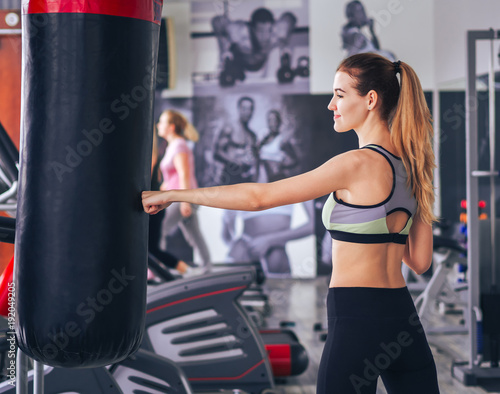 Young girl makes exercises at the gym © Sergii Mironenko