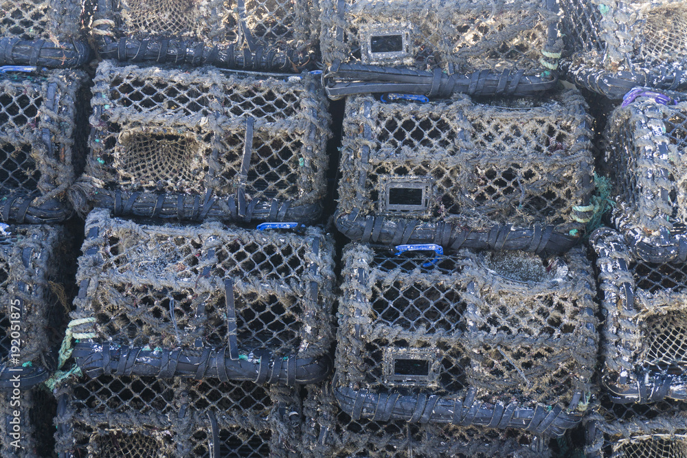 Lobster pots and traps stacked on a quay Lobster pots and traps stacked on a quay