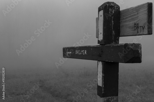 Photo An old sign on the Appalachian Trail points to a shelter written on the wooden board