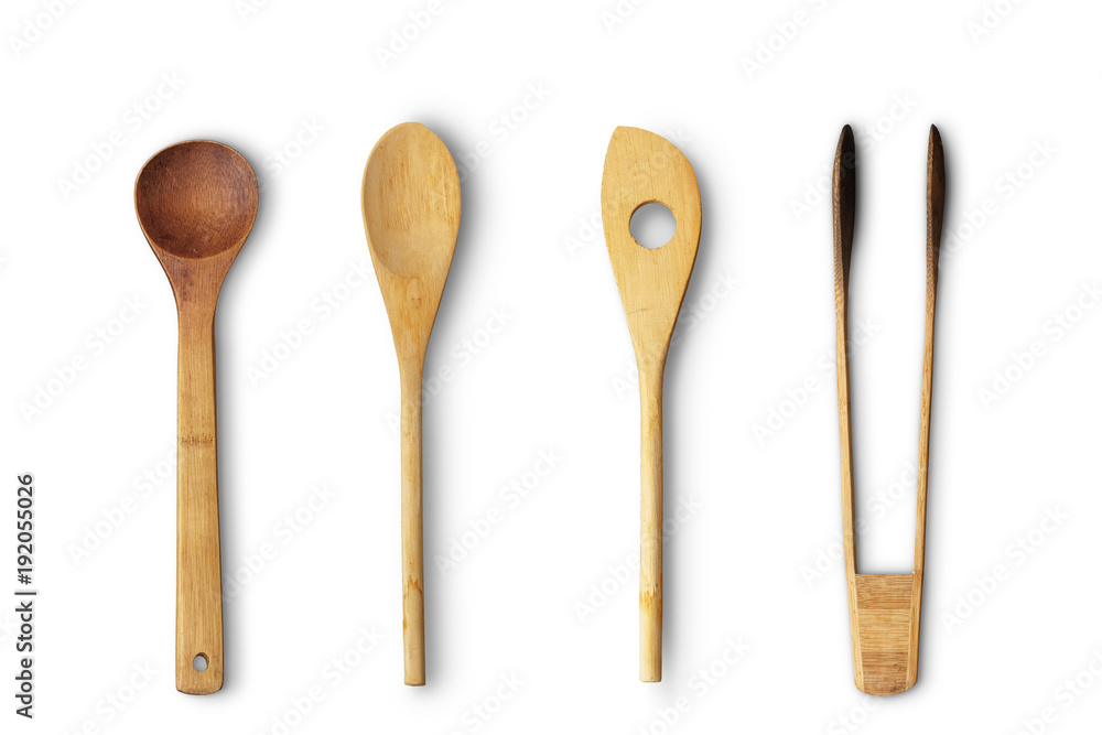 Wooden rustic spoons, forks isolated on white background. Close up. Top view. Wooden rustic spoons, forks isolated on white background. Close up. Top view.
