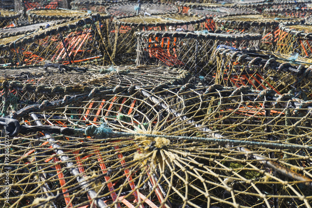 Lobster pots and traps stacked on a quay