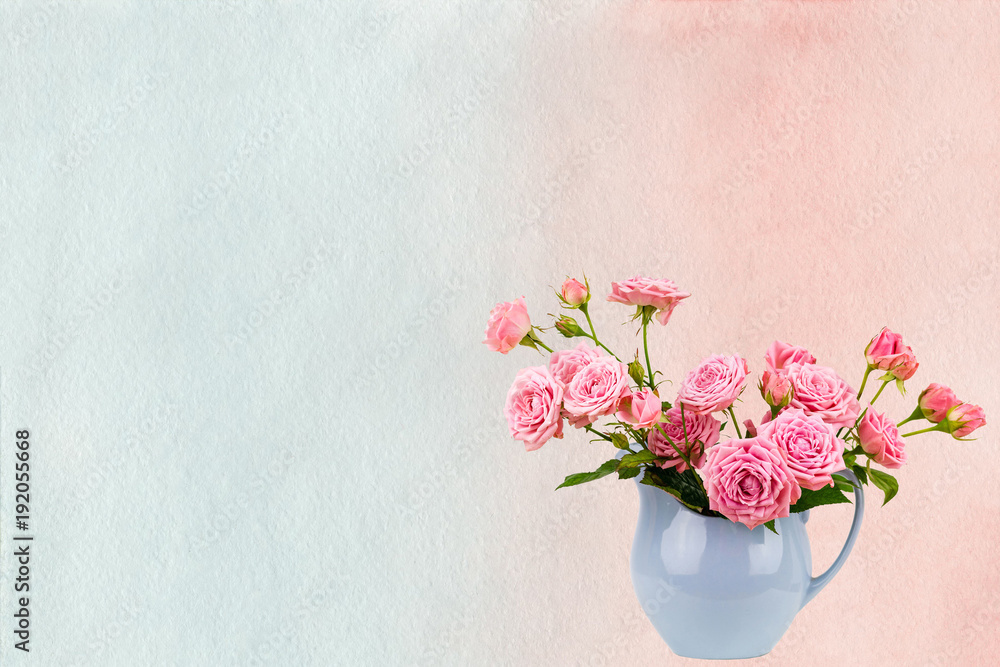 Pink flowers in blue jug on watercolor pink and blue painted background.