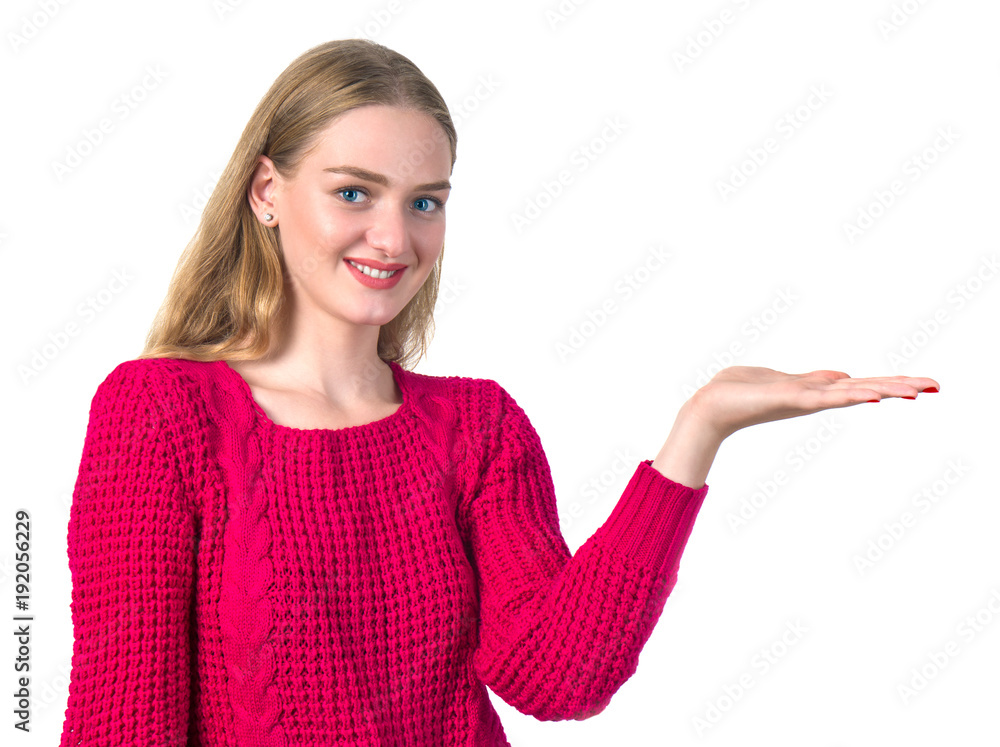 Beautiful blonde girl holding out her hand holding something Beautiful blonde girl holding out her hand holding something