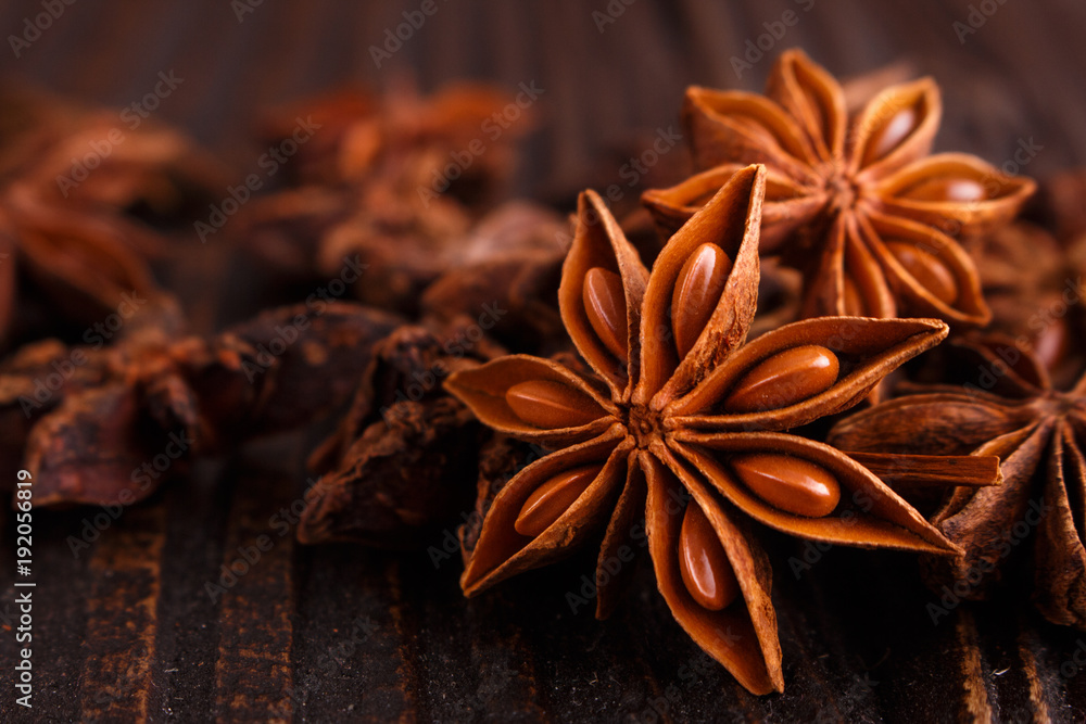 anise stars on a dark rustic background anise stars on a dark rustic background