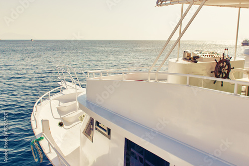 Ship chopping with the rudder in the sun. The place of the captain for control handwheel of the ship.