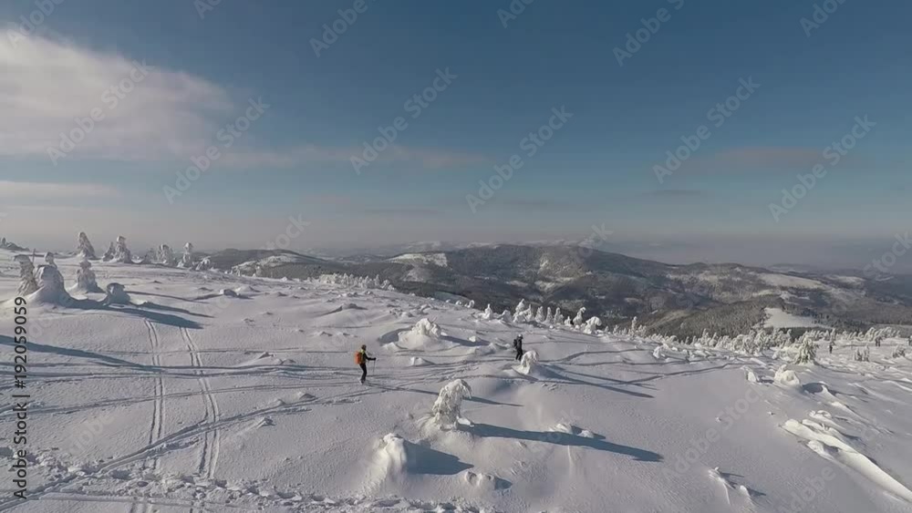 Solitary skier at the top of the mountain Solitary skier at the top of the mountain