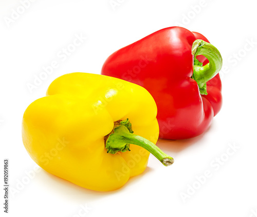 Large, red and yellow ripe peppers isolated on white background photo