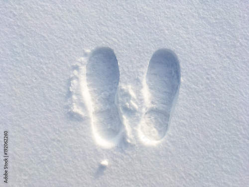 human footprints in the white snow