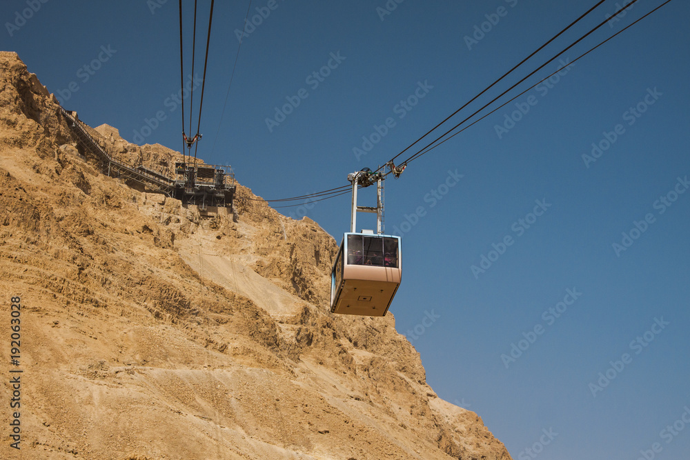 Israel - South - Masada - Aerial ropeway carriage goes from Masada visitor center up to the upper station Israel - South - Masada - Aerial ropeway carriage goes from Masada visitor center up to the upper station