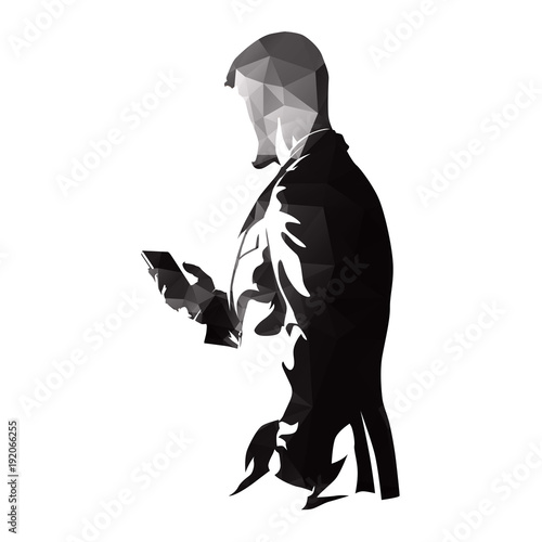 Polygonal businessman in suit with smart phone, isolated vector silhouette