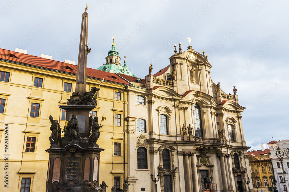 Fototapeta premium St.Nicholas Church and square front of cathedral in the quarter of Mala Strana in Prague in Central Europe, facade of Baroque architecture