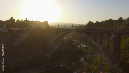 View of car movement on Kievyan Bridge crossing Hrazdan river, Yerevan, Armenia photo