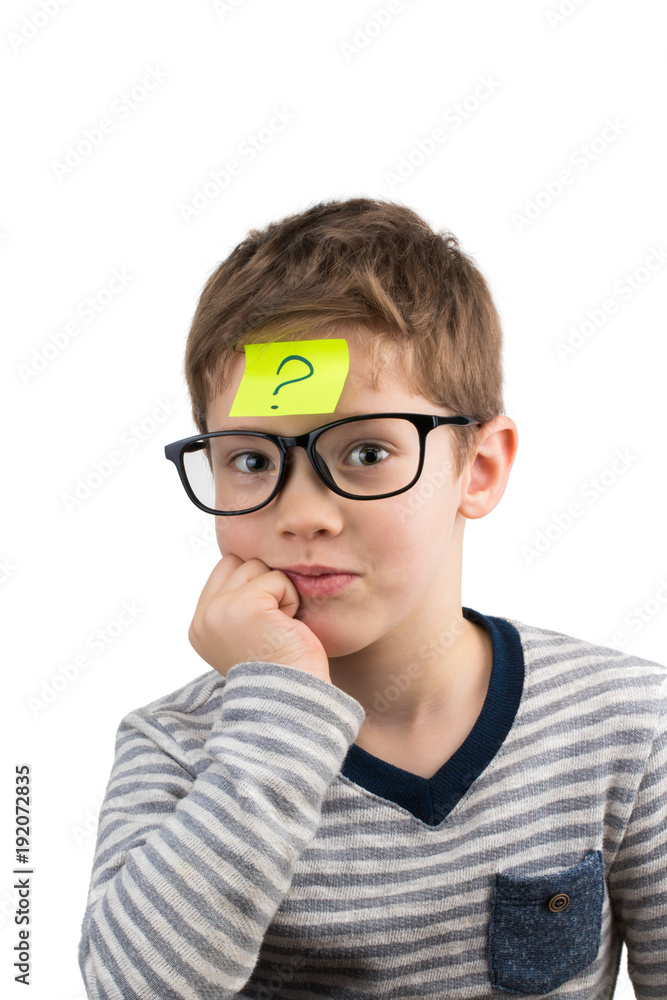 Confused boy thinking with question mark on sticky note on forehead