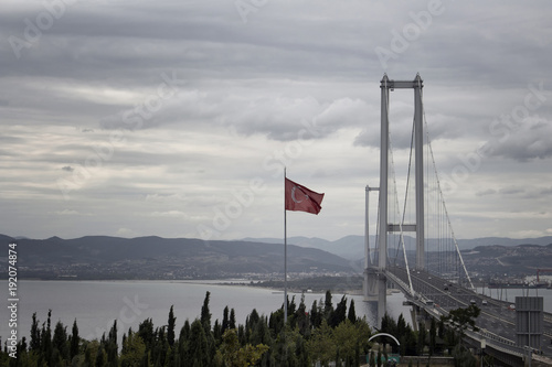 Photography View of newly developed bridge called Osmangazi and Turkish flag