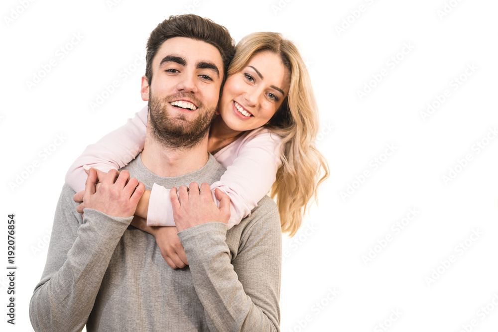 The happy man and a woman hug on the white background The happy man and a woman hug on the white background