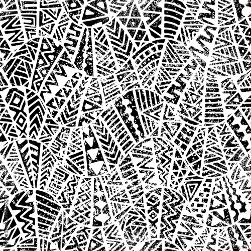 Seamless geometric pattern. Ornament in patchwork style. Grunge texture. Ethnic and tribal motifs. Black and white print. © flovie