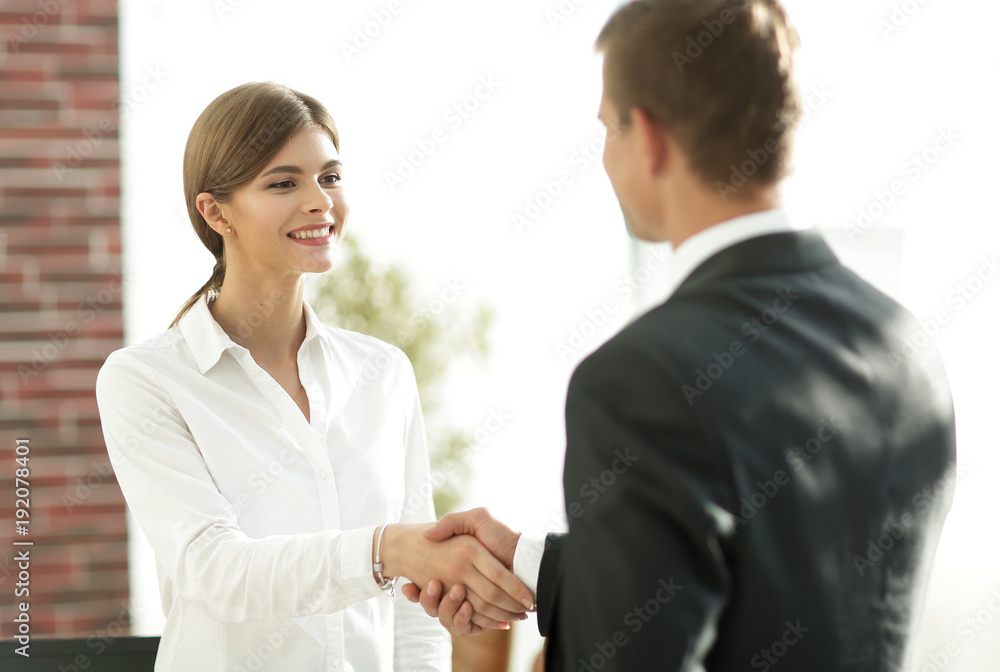 handshake young business woman with a colleague handshake young business woman with a colleague