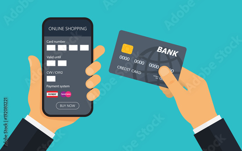 Hand with credit card for payment. Mobile payment.
