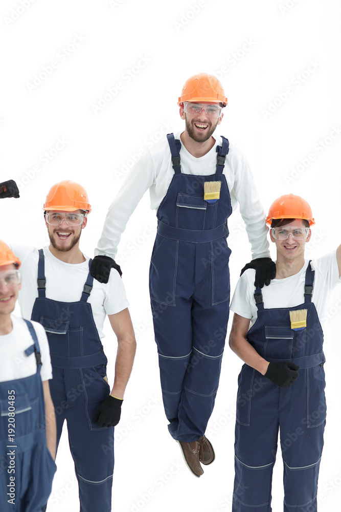 construction worker sitting on the shoulders of colleagues construction worker sitting on the shoulders of colleagues