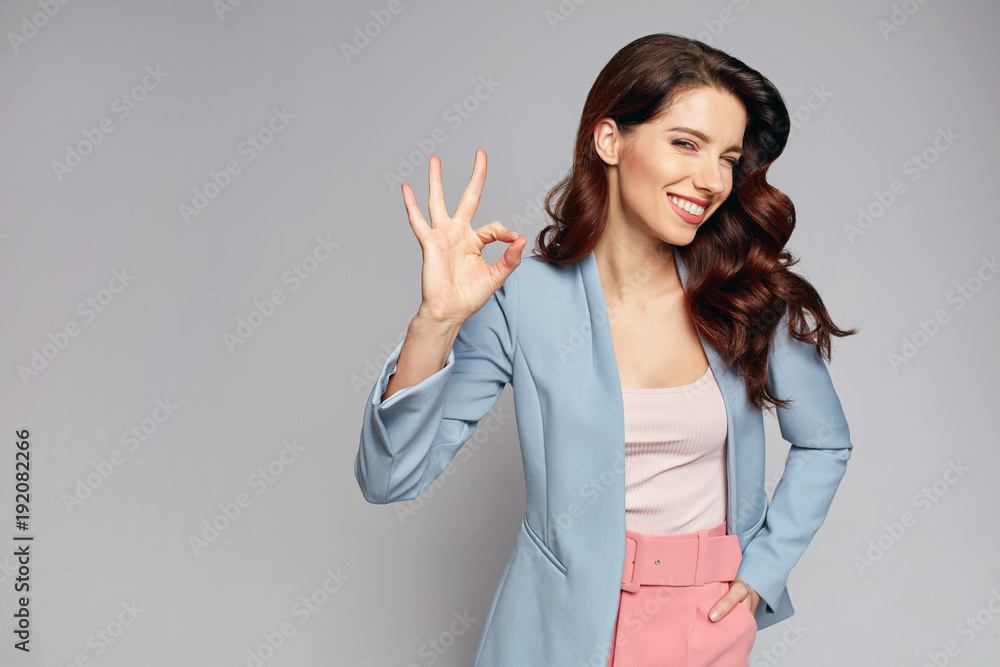 fashionable smiling woman showing okay fashionable smiling woman showing okay