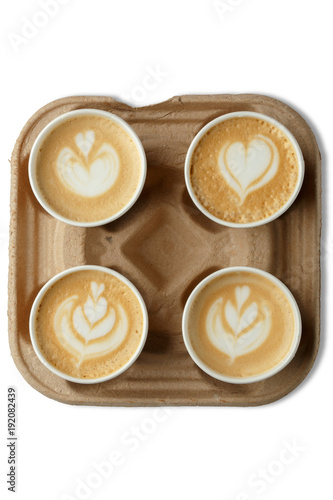 Cappuccino with a delicious foam in a cardboard stand. Latteart. Mok up. Isolated