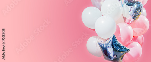 Blank for a holiday greeting card. Pink, white air balloons isolated on a pink background