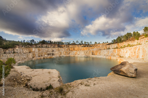 Fototapeta Naklejka Na Ścianę i Meble -  Blue lake in mining industrial crater, acid mine drainage in rock,Spain.