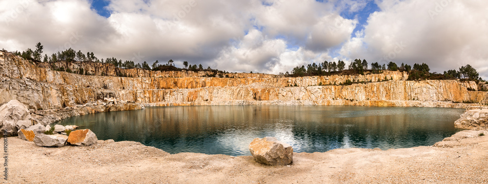 Fototapeta premium Blue lake in mining industrial crater, acid mine drainage in rock,Spain.