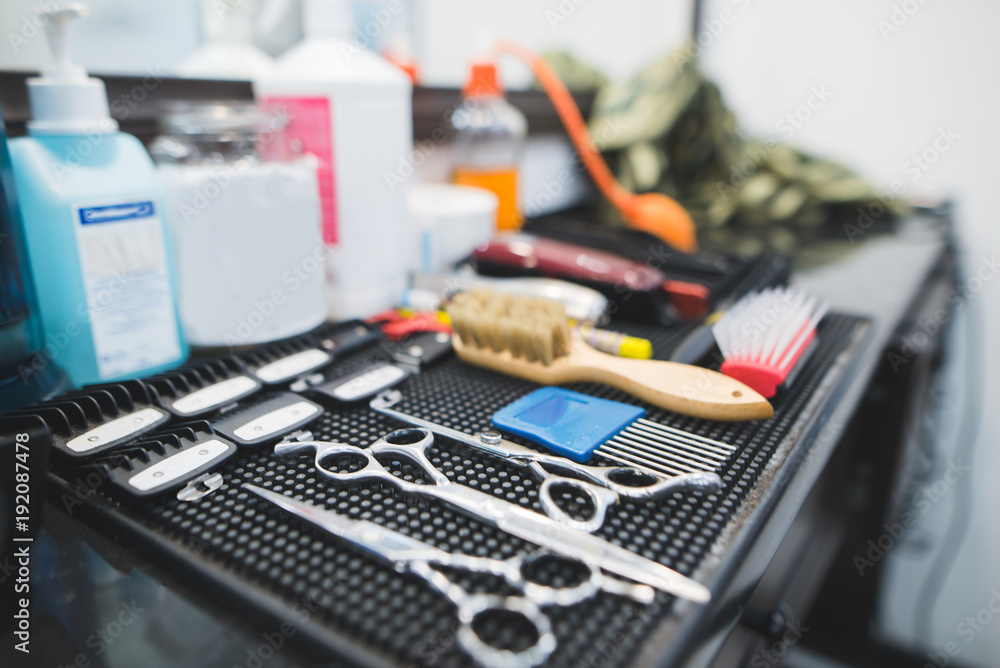 Barber tools in the workplace. A set of working tools for a hairdresser on the table. Barber tools in the workplace. A set of working tools for a hairdresser on the table.