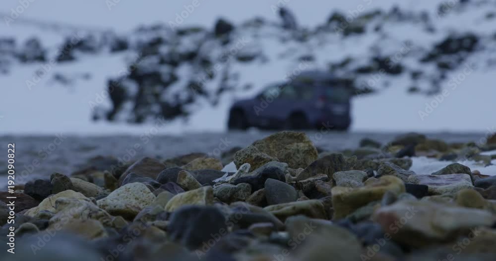 Close up, truck drives through river in Iceland Close up, truck drives through river in Iceland