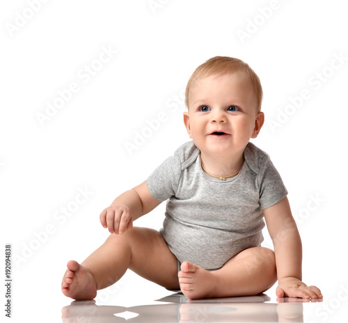 Infant child baby boy toddler sitting naked in grey body  © Dmitry Lobanov