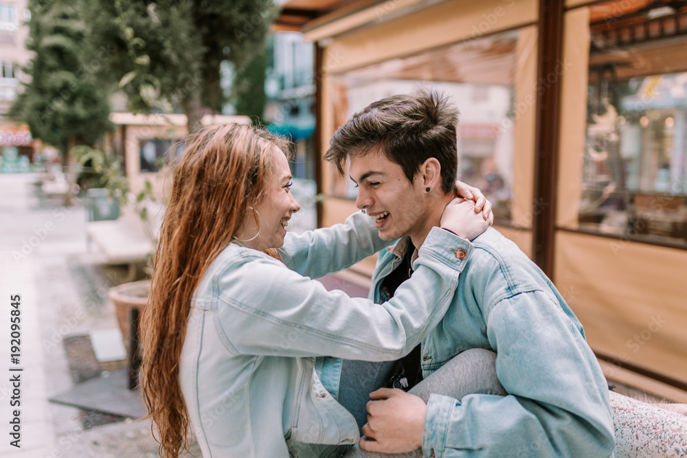 Couple in love having a good time. Couple having fun. Young lovers enjoying a sunny day.