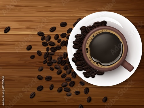 Cup of coffee with coffee beans on brown wooden background