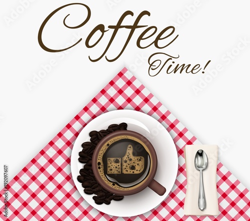 Cup of coffee with coffee beans and spoon on a tablecloth background