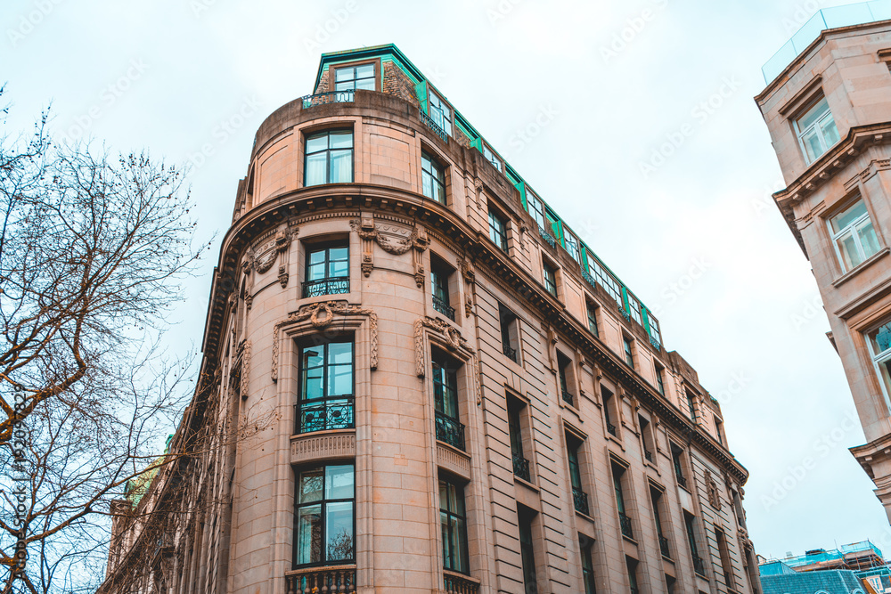 orange curved real estate corner building in london