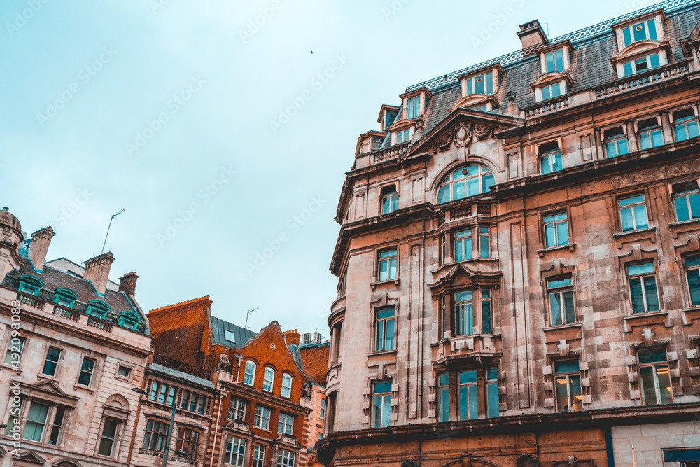 Obraz premium some orange facaded residential houses in a street at london