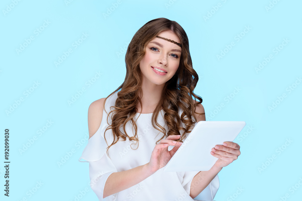 happy young woman with digital tablet isolated on blue happy young woman with digital tablet isolated on blue