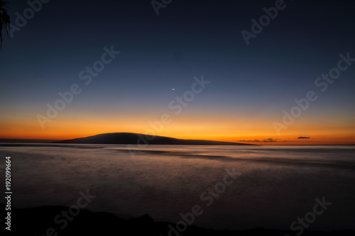 Moonset over Lanai from Baby Beach on Maui.